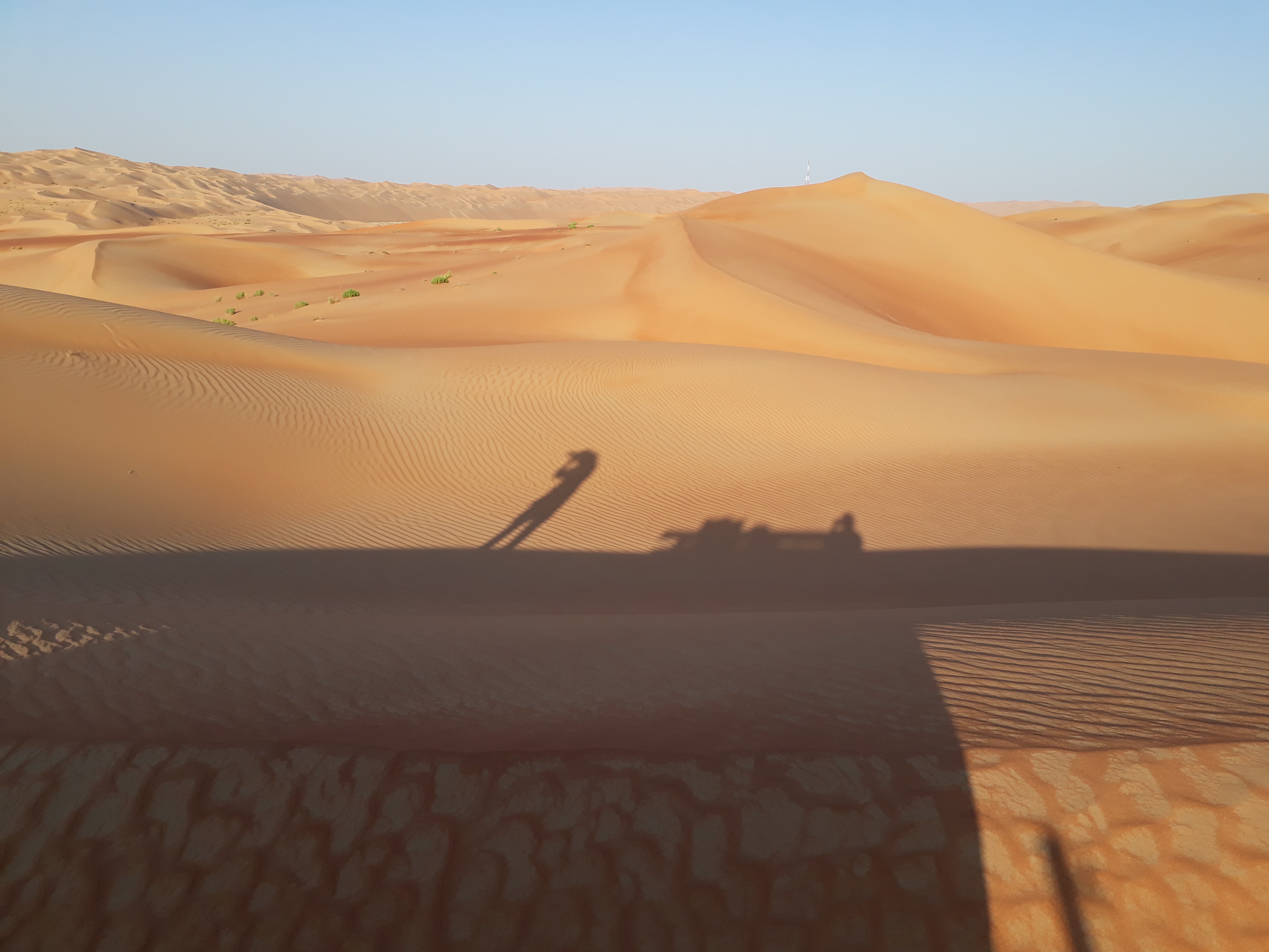 A photographer's shadow on the sands of the Rub Al Khali